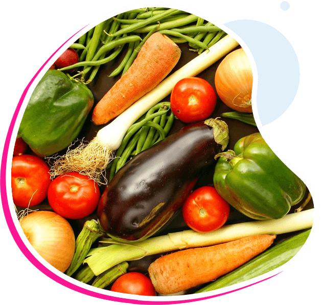 A bowl of vegetables is shown with an apple.