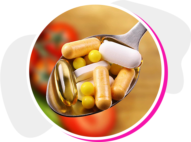 A spoon filled with pills and supplements on top of a table.